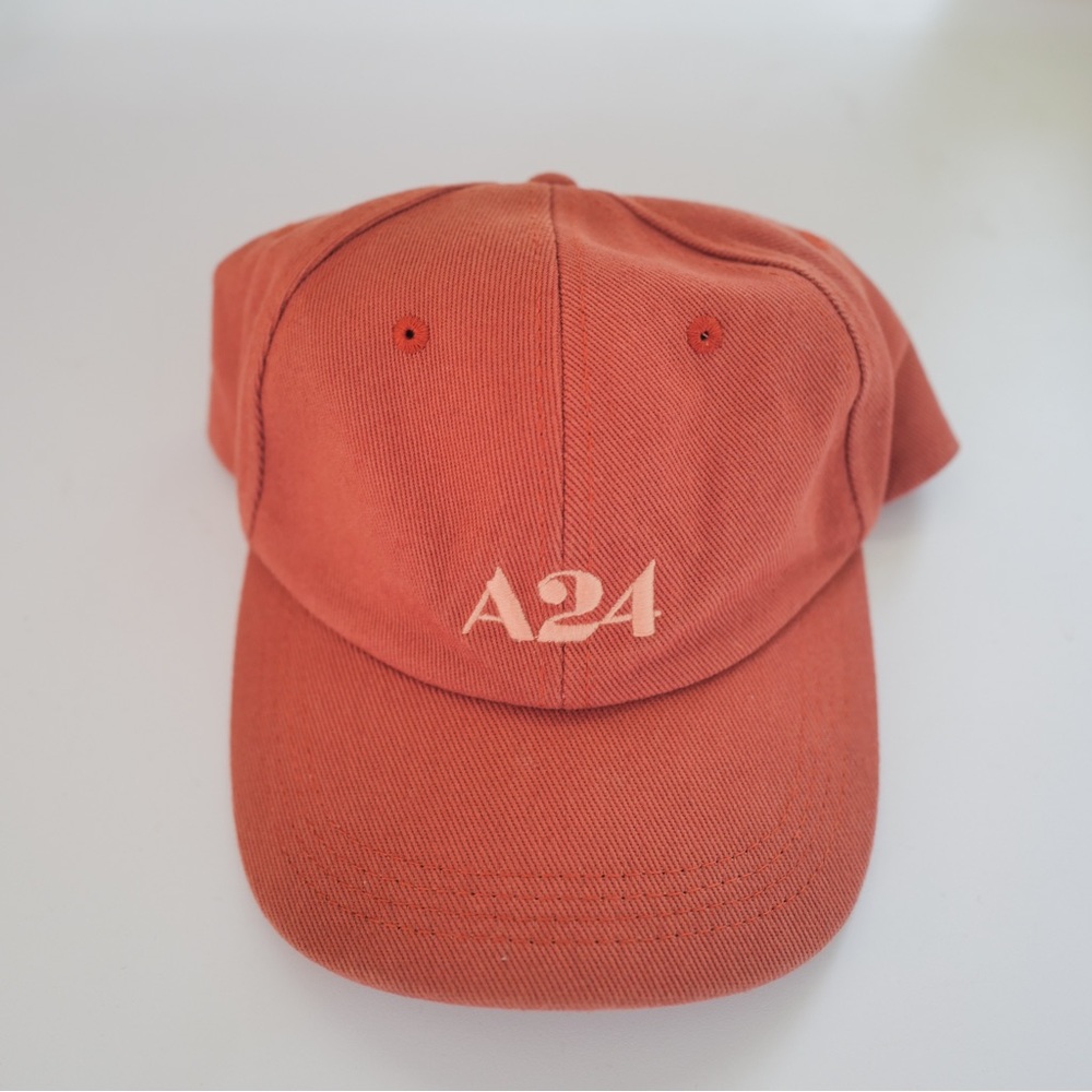 A24 dad cap in coral with dusty pink stitching